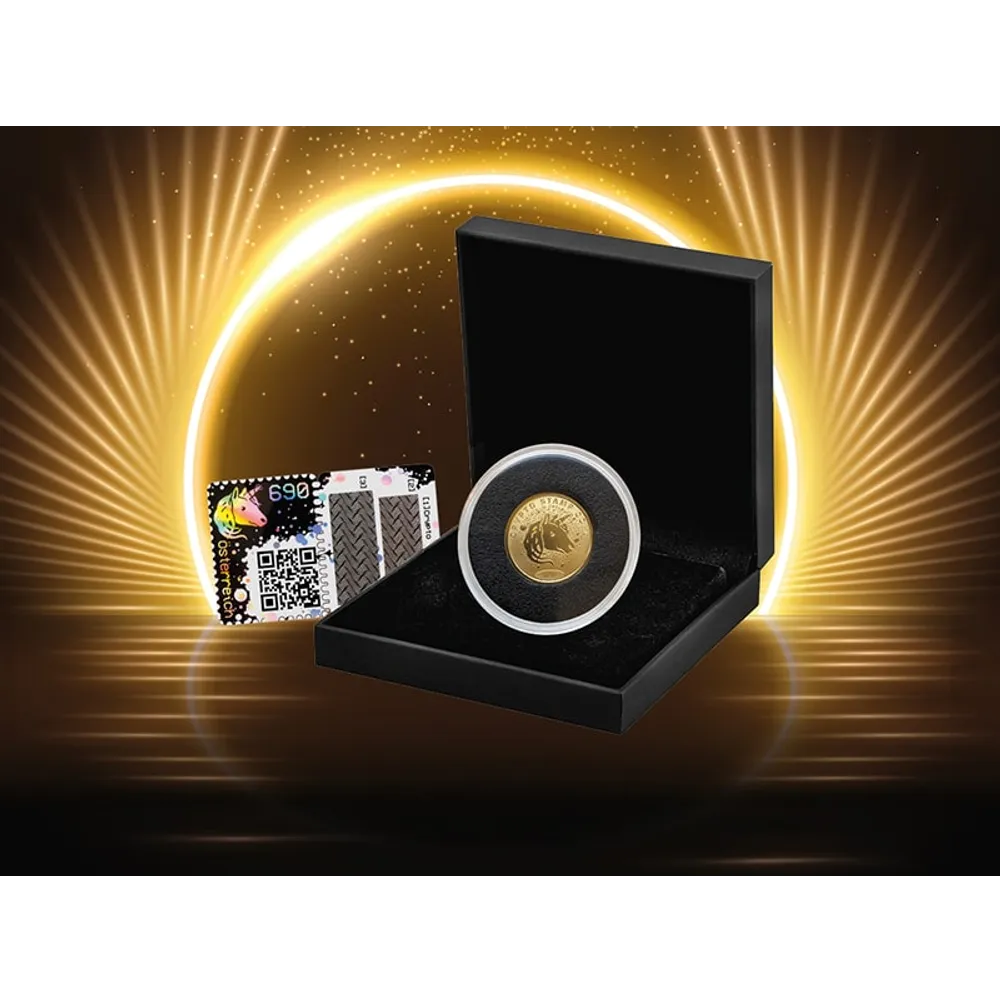 Sammlermünze der Österreichischen Post in schwarzer Box mit holografischer Zertifikatskarte, goldener Licht-Hintergrund.