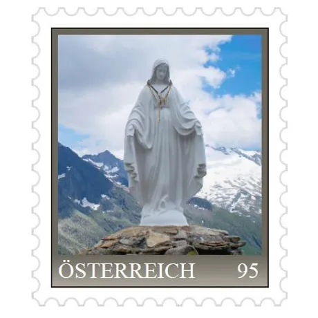 Austrian stamp 95 cents, featuring a statue of the Virgin Mary with alpine mountains in the background, 2023.