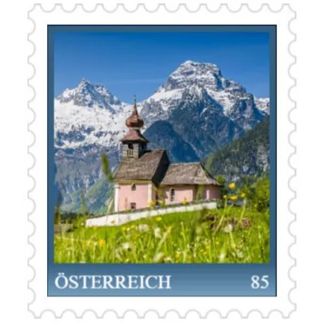 cd1a0e8f164f740303d9130d6e1974277c8a967e.jpg Austrian stamp 2023, nominal value 0.85 euros: Alpine chapel with snowy mountains in the background.