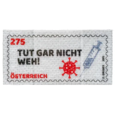 Austrian stamp 2021, nominal value 2.75 euros: COVID-19 theme with syringe and virus illustration, text 'TUT GAR NICHT WEH!'.