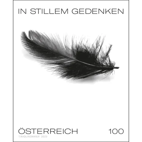 Austrian stamp 2023, nominal value 1.00 Euro: Black feather with text &#039;In silent remembrance&#039;.